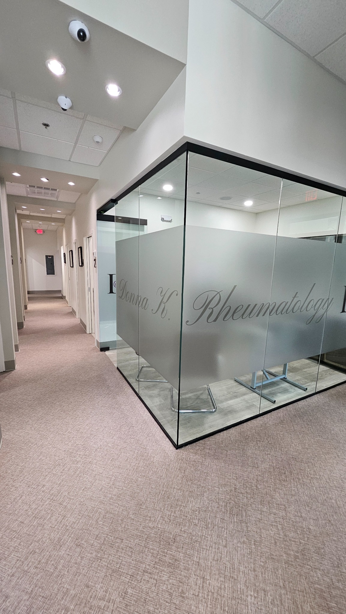 Clinic hallway and glass consultation room